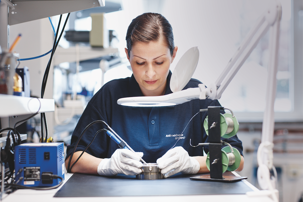 A worker soldering